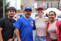 Group photo of four TRP staff members outdoors. They are facing the camera, standing and smiling.