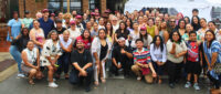 Large group photo of TRP staff and volunteers outdoors.